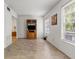 Bright living room featuring tile floors, large windows, and a built-in entertainment center at 2426 Persian Dr # 52, Clearwater, FL 33763