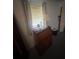 Bedroom with a dresser, curtained window, and table lamp at 2507 Hollis Dr, Tampa, FL 33618