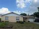 Charming single-story home with well-maintained lawn and attached garage at 2507 Hollis Dr, Tampa, FL 33618