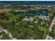Expansive aerial view highlighting community amenities: parks, pools, baseball fields and lush green spaces at 2880 81St N St, St Petersburg, FL 33710