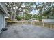 Spacious back porch with railing, providing ample outdoor space for relaxation and entertainment at 2880 81St N St, St Petersburg, FL 33710