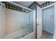 Bathroom featuring a shower and tub combination with a glass enclosure at 2880 81St N St, St Petersburg, FL 33710