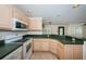 Charming kitchen with a convenient breakfast bar and seamless flow to the living area at 2880 81St N St, St Petersburg, FL 33710