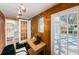 Cozy office space features wood paneled walls, outdoor access and adjacent bathroom at 2880 81St N St, St Petersburg, FL 33710
