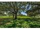 Picturesque park featuring mature trees providing ample shade over a lush green lawn at 2880 81St N St, St Petersburg, FL 33710