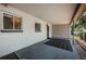 Cozy covered patio area featuring a patterned mat, offering a private outdoor space for relaxation and enjoyment at 2880 81St N St, St Petersburg, FL 33710