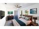 Well-lit bedroom with modern furnishings, a comfortable bed, and calming decor at 308 E 121St Ave, Tampa, FL 33612
