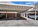 Assigned covered parking featuring white support posts and gray gravel parking spot at 308 S Bungalow Park Ave # B, Tampa, FL 33609