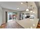 Modern kitchen with white cabinets, stainless steel appliances, and adjacent patio at 308 S Bungalow Park Ave # B, Tampa, FL 33609