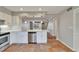Bright kitchen with white cabinets, stainless steel appliances, subway tile backsplash and tile floor at 308 S Bungalow Park Ave # B, Tampa, FL 33609