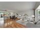 Stylishly furnished living room with hardwood floors, breakfast bar, and comfortable seating area at 308 S Bungalow Park Ave # B, Tampa, FL 33609