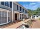 Attractive townhome with well-maintained landscaping, fountain, and brick walkway at 308 S Bungalow Park Ave # B, Tampa, FL 33609
