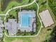 Drone shot of a lap pool and basketball court in a community, showing a perfect spot for leisure and recreation at 32713 Brooks Hawk Ln, Wesley Chapel, FL 33543