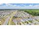Expansive aerial view of a meticulously planned community with sidewalks and manicured landscaping on a bright, sunny day at 32713 Brooks Hawk Ln, Wesley Chapel, FL 33543