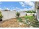 Large fenced backyard offering privacy and space for outdoor activities and gardening at 32713 Brooks Hawk Ln, Wesley Chapel, FL 33543