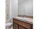 Bathroom featuring a single sink vanity with dark wood cabinets and shower/tub combo with white tile surround at 32713 Brooks Hawk Ln, Wesley Chapel, FL 33543