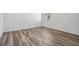 Bedroom featuring new floors, new baseboards, fresh paint, and window with blinds at 32713 Brooks Hawk Ln, Wesley Chapel, FL 33543