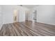 Spacious bedroom featuring stylish vinyl plank flooring and ample natural light at 32713 Brooks Hawk Ln, Wesley Chapel, FL 33543