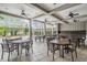 Community outdoor seating area with multiple tables and fans overhead at 32713 Brooks Hawk Ln, Wesley Chapel, FL 33543