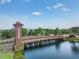 Picturesque wooden bridge in Union Park, with a tranquil waterfront view at 32713 Brooks Hawk Ln, Wesley Chapel, FL 33543