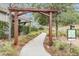 Scenic community walking path with wooden pergola and lush landscaping at 32713 Brooks Hawk Ln, Wesley Chapel, FL 33543