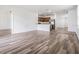 Spacious living room featuring stylish vinyl plank flooring, offering a modern and inviting atmosphere at 32713 Brooks Hawk Ln, Wesley Chapel, FL 33543
