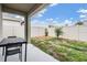 Outdoor patio featuring a covered seating area and a well-maintained lawn at 32713 Brooks Hawk Ln, Wesley Chapel, FL 33543