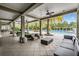 Relaxing poolside lounge area with comfortable seating and scenic views of the community pool at 32713 Brooks Hawk Ln, Wesley Chapel, FL 33543