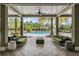 Inviting poolside lounge with comfortable sofas, chairs, and serene views of the community at 32713 Brooks Hawk Ln, Wesley Chapel, FL 33543