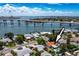 Beautiful home with a pool and bay views from an elevated aerial view at 3555 Belle Vista E Dr, St Pete Beach, FL 33706