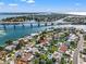 Scenic aerial shot of a waterfront home near a bridge, capturing the picturesque neighborhood at 3555 Belle Vista E Dr, St Pete Beach, FL 33706