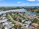 Breathtaking aerial view of the waterfront community with stunning ocean views and lush tropical landscaping at 3555 Belle Vista E Dr, St Pete Beach, FL 33706