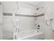 Stylish bathroom with a white tub, tiled walls, and modern fixtures, offering a clean and elegant space at 3555 Belle Vista E Dr, St Pete Beach, FL 33706