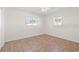 Bright, spacious bedroom features tiled flooring, lots of natural light, and modern ceiling fan at 3555 Belle Vista E Dr, St Pete Beach, FL 33706