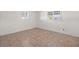 Bright and airy bedroom with tiled flooring, fresh paint, and lots of natural light at 3555 Belle Vista E Dr, St Pete Beach, FL 33706