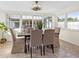 Bright dining room with large windows and neutral tones creates an inviting atmosphere at 3555 Belle Vista E Dr, St Pete Beach, FL 33706