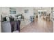 Inviting living room featuring stylish decor, comfortable seating, and seamless transition to dining area at 3555 Belle Vista E Dr, St Pete Beach, FL 33706