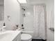 A compact yet efficient bathroom features a shower-tub combination and modern finishes at 3558 65Th Avenue E Cir, Sarasota, FL 34243