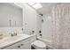 A bright bathroom with a shower-tub combination and modern vanity at 3558 65Th Avenue E Cir, Sarasota, FL 34243