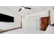 This bedroom features a ceiling fan, and a closet with sliding doors at 3558 65Th Avenue E Cir, Sarasota, FL 34243