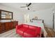 Bedroom featuring a seating area, ceiling fan, and laminate wood flooring at 3558 65Th Avenue E Cir, Sarasota, FL 34243
