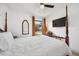 Bedroom with a TV, ceiling fan, and view to the back yard at 3558 65Th Avenue E Cir, Sarasota, FL 34243