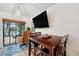 Inviting breakfast nook offers natural light, serene water views and media at 3558 65Th Avenue E Cir, Sarasota, FL 34243
