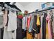 Walk-in closet featuring shelving, and racks for optimal storage space at 3558 65Th Avenue E Cir, Sarasota, FL 34243