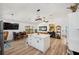 Open-concept kitchen with island, dining area, and living space, ideal for entertaining and daily living at 3558 65Th Avenue E Cir, Sarasota, FL 34243
