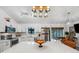 Beautiful kitchen featuring stainless appliances, modern light fixtures, and a stone countertop island at 3558 65Th Avenue E Cir, Sarasota, FL 34243