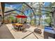 Spacious screened lanai with comfortable seating and dining, perfect for outdoor enjoyment at 3558 65Th Avenue E Cir, Sarasota, FL 34243