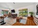 Inviting living area featuring modern furnishings, a flat-screen TV, and a bright window view at 3558 65Th Avenue E Cir, Sarasota, FL 34243