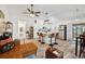 Spacious and light-filled living space combining a living room and modern kitchen with island at 3558 65Th Avenue E Cir, Sarasota, FL 34243