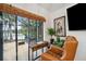 Bright and airy office with water view, a comfortable chair and a vintage desk at 3558 65Th Avenue E Cir, Sarasota, FL 34243